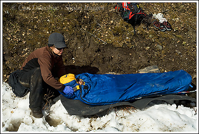 A wilderness First Responder course simulation has this rescuer stabilizing a patient