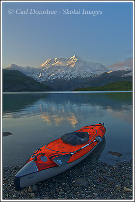 Sea kayaking Icy Bay with Mt. St. Elias in the background, Wrangell St. Elias National Park, Alaska.