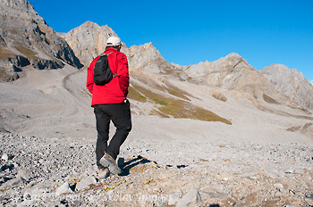 Hiking along the lateral moraine of Kennicott Glacier, near Mount Blackburn, Wrangell-St. Elias National Park and Preserve, Alaska.