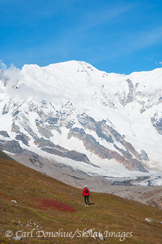 Hiker and Mt Blackburn, Wrangell-St. Elias, Alaska.