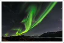 Active display of the northern lights over the Chugach Mountains, near the Matanuska Glacier, Alaska
