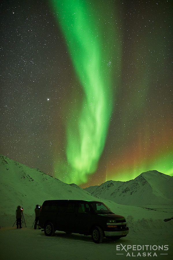 Photographing the Northern lights over Brooks Range Mountains in Arctic Alaska.