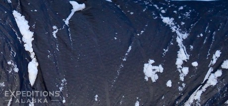 Crop of photo from winter sleeping bag with snow