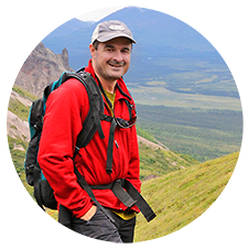 Expeditions Alaska guide and owner Carl Donohue hiking near Nabesna.