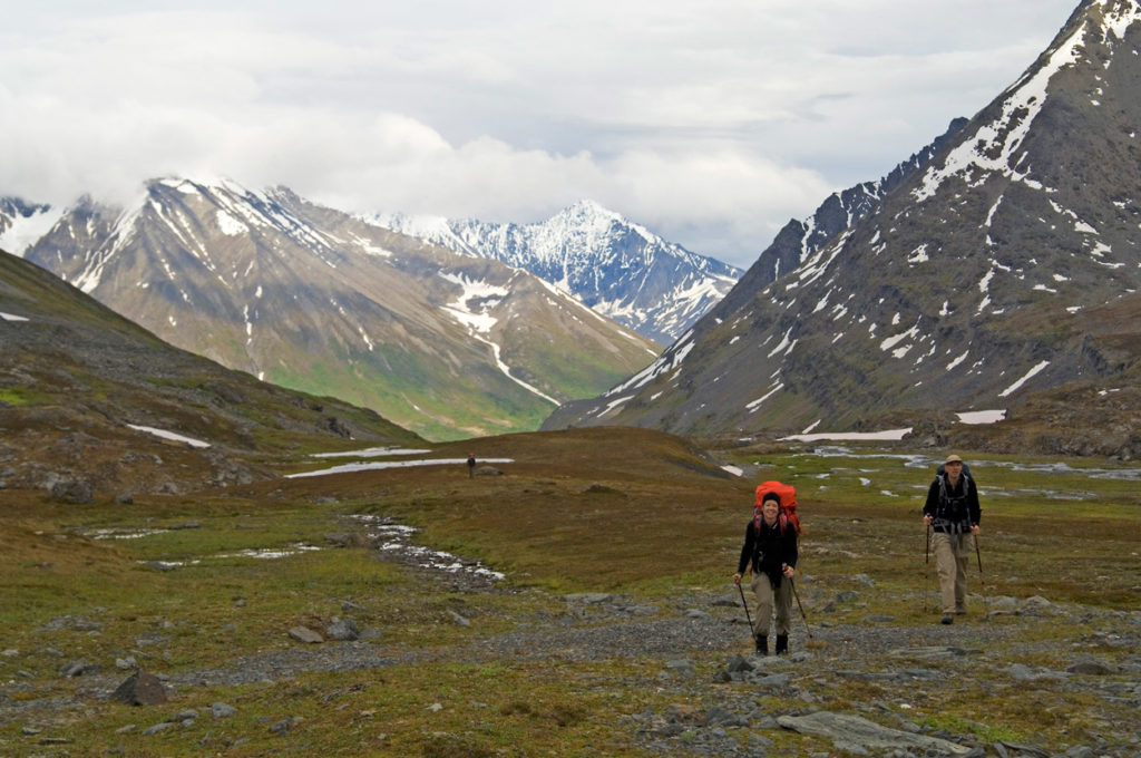 Hiking up Harry's Gulch in Chugach mountains backpacking trip Wrangell-St. Elias National Park Alaska.