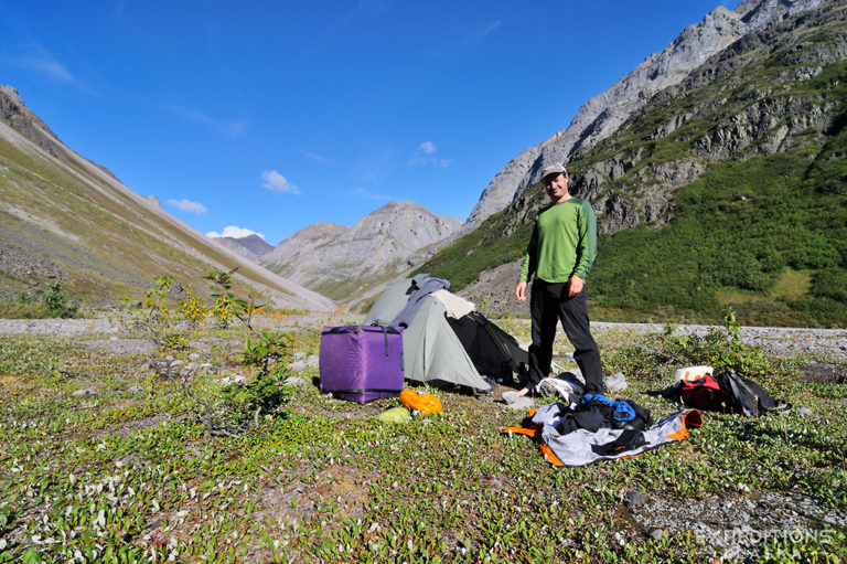 Packing up camp whilst backpacking Hidden Creek, Wrangell-St. Elias National Park, Alaska.