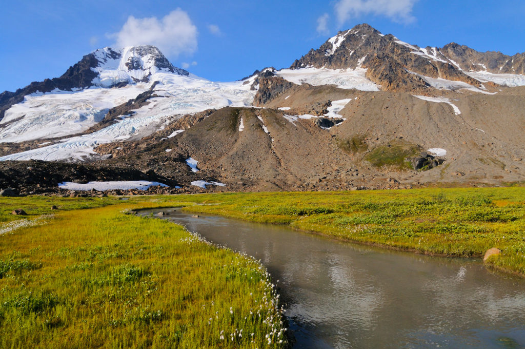 iceberg Lake to Bremner Mines hiking trip, Mountain and stream Wrangell St. Elias National Park, Alaska.