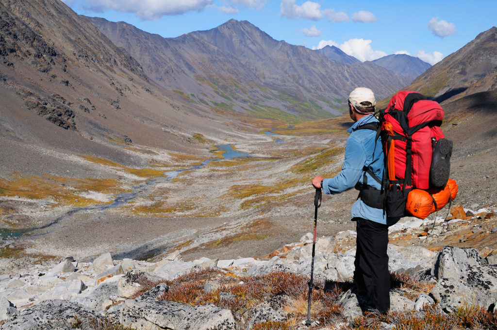 Alaska backpacking trips Seven Pass Backpacking trip, hiker in Chugach Mountains, Wrangell-St. Elias National Park, Alaska.