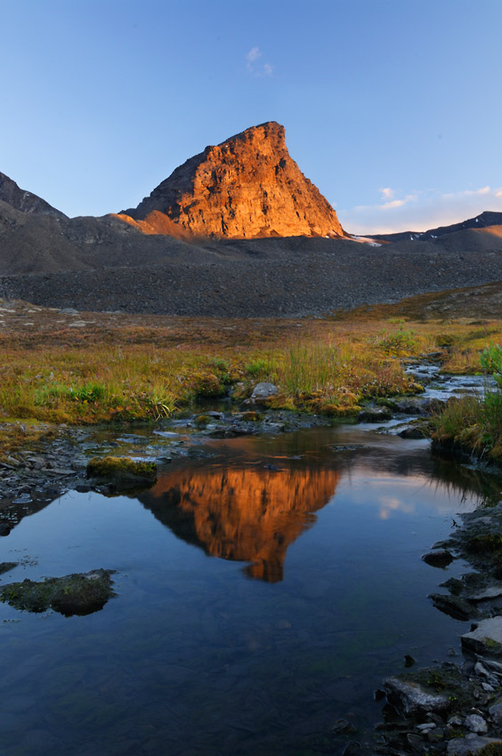 Reflection on unnamed peak on Seven Pass Route backpacking trip Wrangell-St. Elias National Park, Alaska.