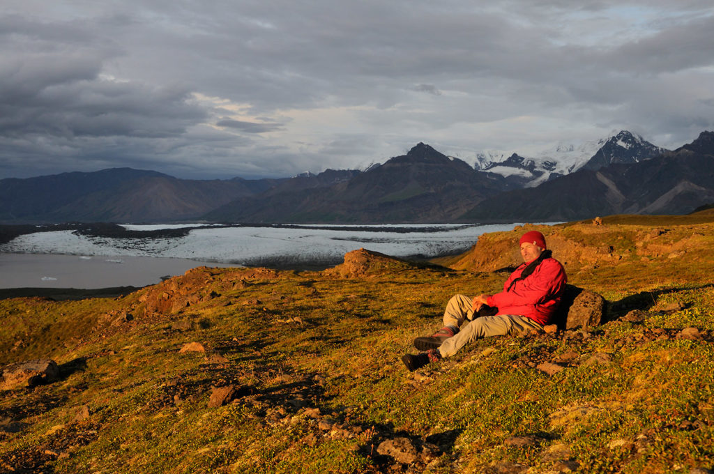 Alaska landscapes photo tour Hiker in the evening at Chitistone pass, Wrangell-St. Elias National Park, Alaska.