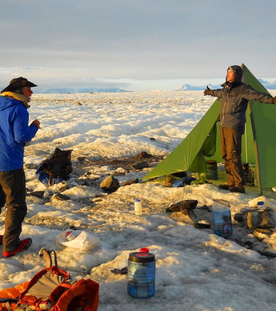 Backpacking trip Malaspina Glacier Cook tent and kitchen on Malaspina Glacier backpacking trek, Wrangell-St. Elias National Park, Alaska.