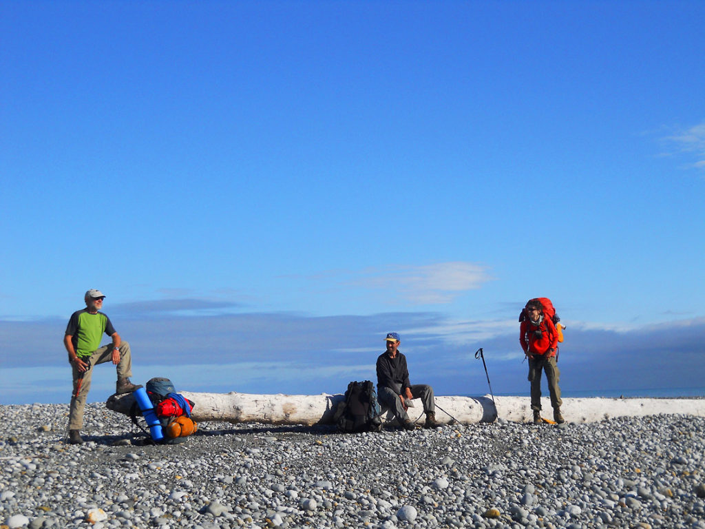 Breaking camp on Malaspina Glacier backpacking trip, lost Coast, Wrangell-St. Elias National Park, Alaska.