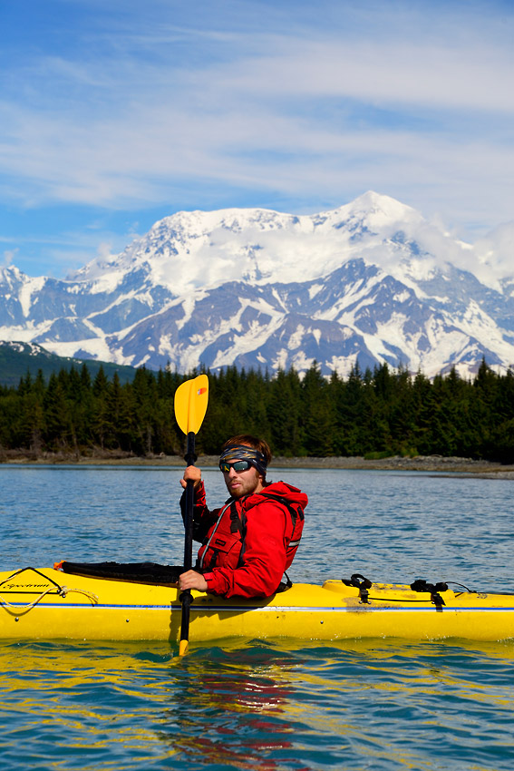 Guided sea kayaking trip Alaska Sea kayaker and Mt. St. Elias, Icy Bay sea kayaking trip, Wrangell-St. Elias National Park, Alaska.