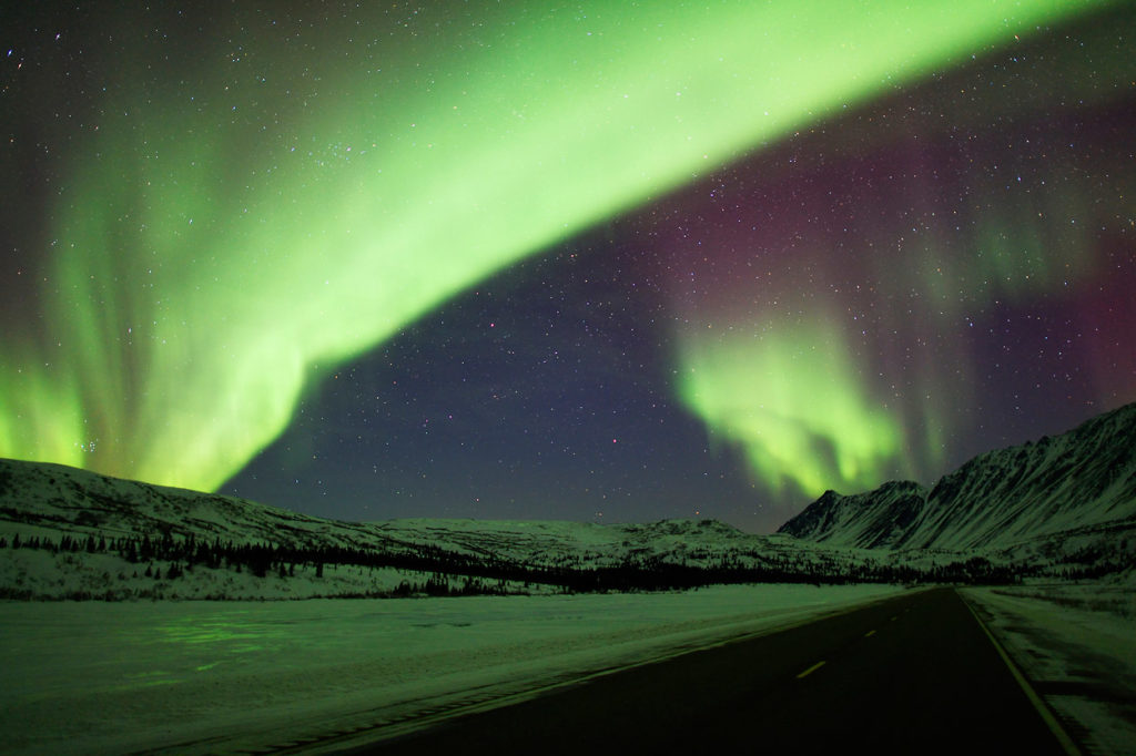 Aurora borealis photo tour and Alaska Range mountains in Alaska.
