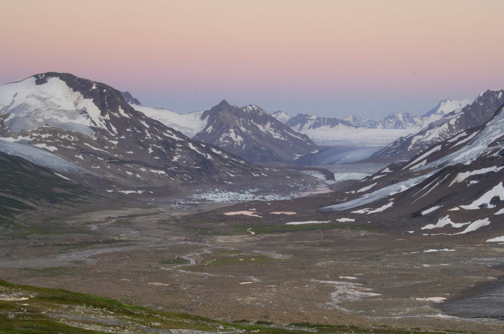 Sunset photo of Iceberg Lake valley on Seven Pass Route backpacking trip, Wrangell-St. Elias National Park, Alaska.