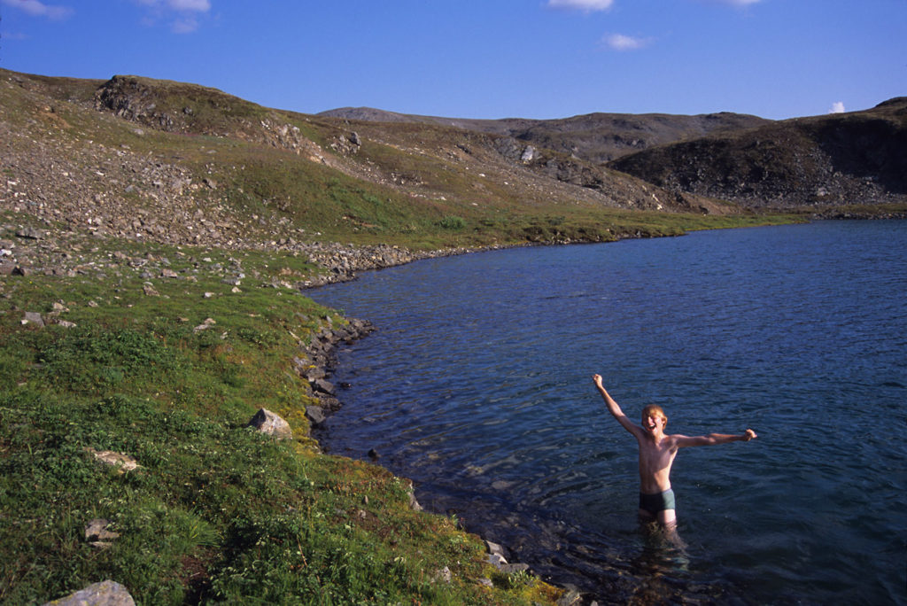 Steamboat Hills hiking and backpacking trip swimming Wrangell-St. Elias National Park, Alaska.