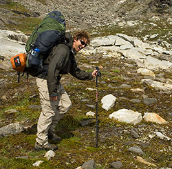 Hiker with a heavy backpack on Seven Pass Backpacking trip in Wrangell-St. Elias National Park, Alaska.