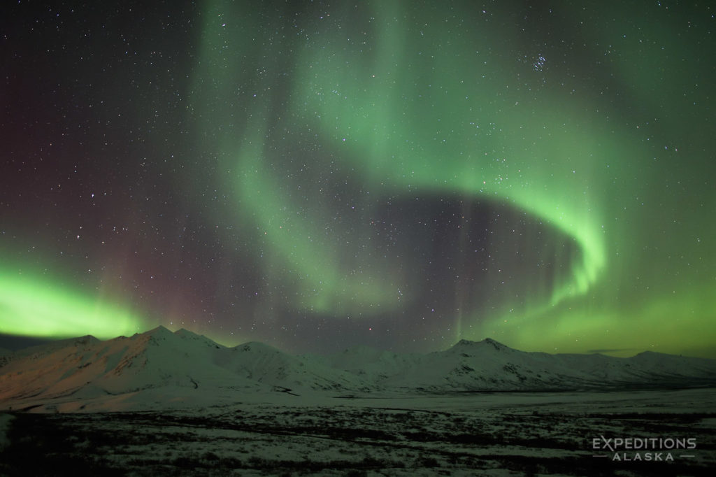 Northern lights photo tour over Brooks Mountains Alaska.