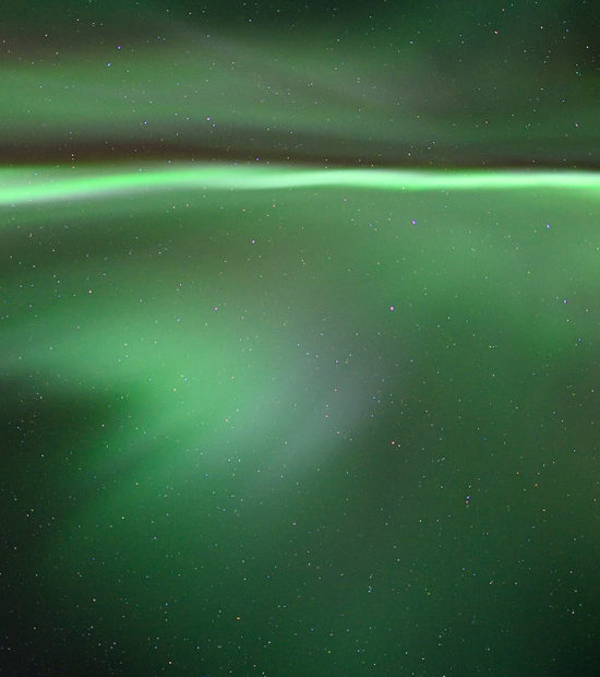 Aurora borealis over head, Alaska.