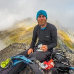 Alaska backpacking guide Rhane Pfeiffer at snack time.