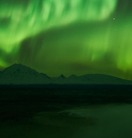 Aurora borealis photo of lights over Wrangell St Elias National Park.