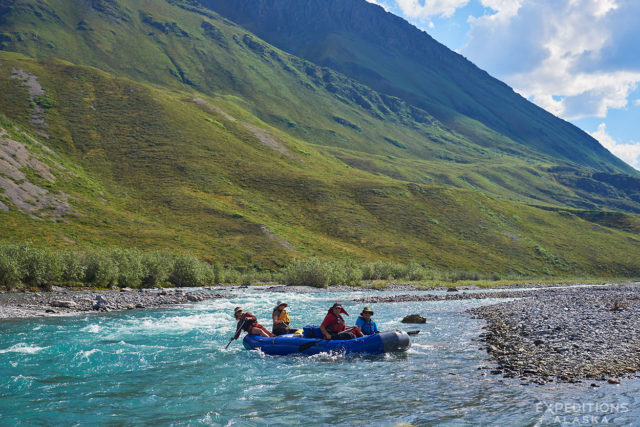 Jule expertly guiding a boat full of rafters and gear down the Marsh Fork River, on our way to the Canning River, Arctic National Wildlife Refuge, ANWR, Alaska.