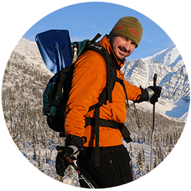 Carl skiing and Mt Blackburn.