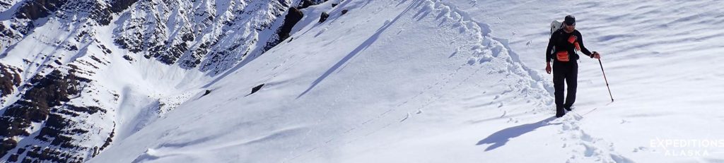 Backpacker crossing continental divide, Gates of the Arctic National Park, Alaska.
