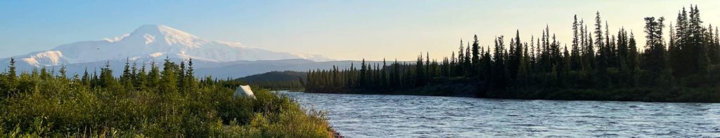 View of packrafting campsite and Mt Sanford and Copper river, Wrangell-St. Elias National Park, Alaska.