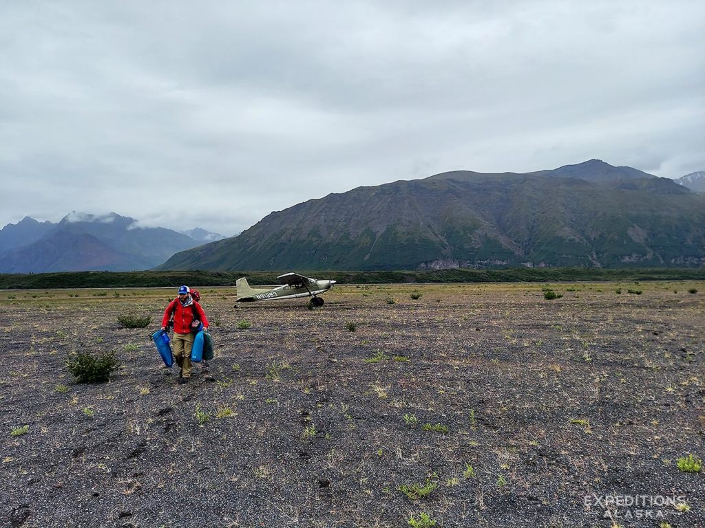 Unloading the plane with our gear, Packrafting Copper River trip, Wrangell-St. Elias National Park, Alaska.