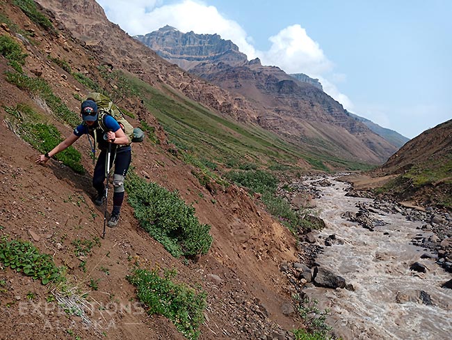 Backpacking over scree slope before the Goat Trail, Wrangell-St. Elias National Park, Alaska.