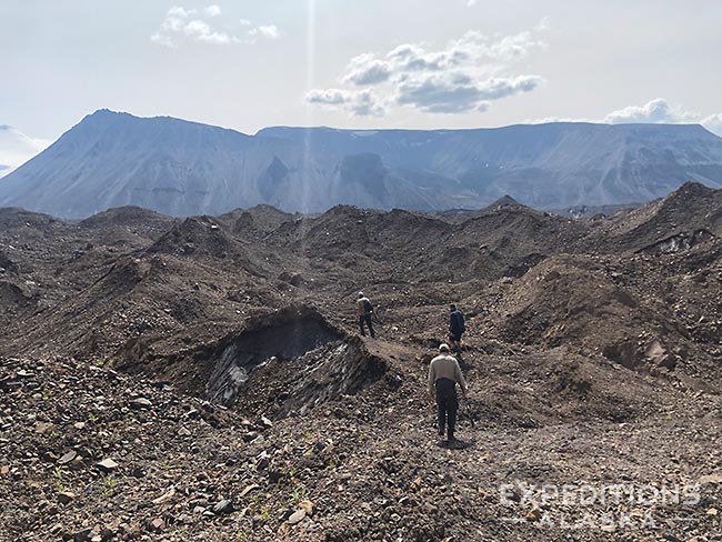 Hiking across Moraine, Sanford Plateau Trip, Wrangell-St. Elias National Park, Alaska.