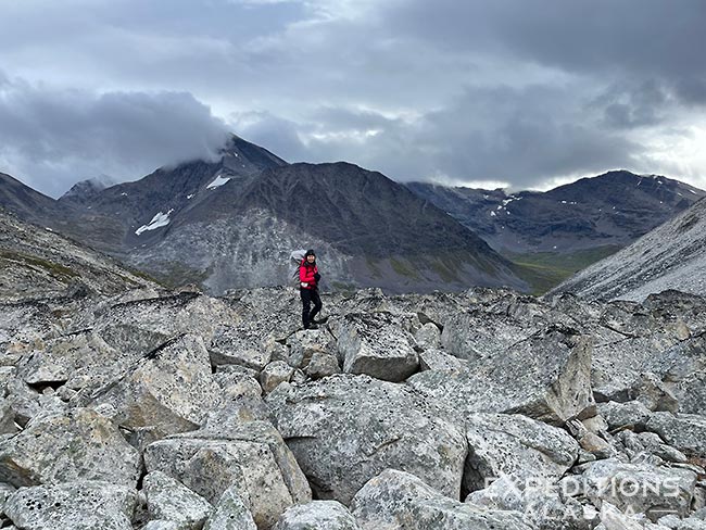 Backpacking over Boulder fields, 7 Pass Route, Wrangell - St. Elias National Park, Alaska.