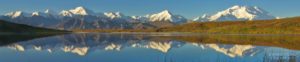 "Denali", officially again known as Mt. Denali, the highest peak in North America, stands above the Alaska Range, a small kettle pond returning a perfect reflection. Denali National Park, Alaska.
