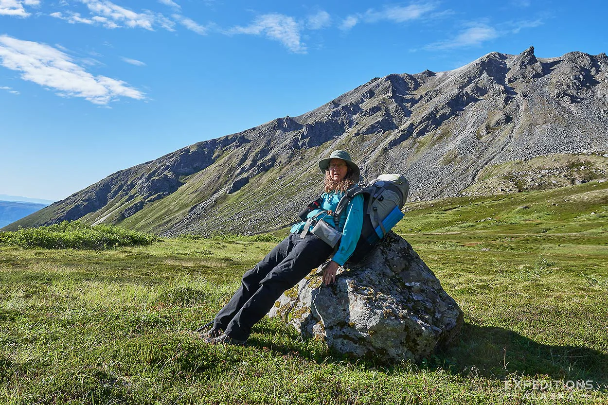Resting on a rock, Denali National Park backpacking trip, Alaska