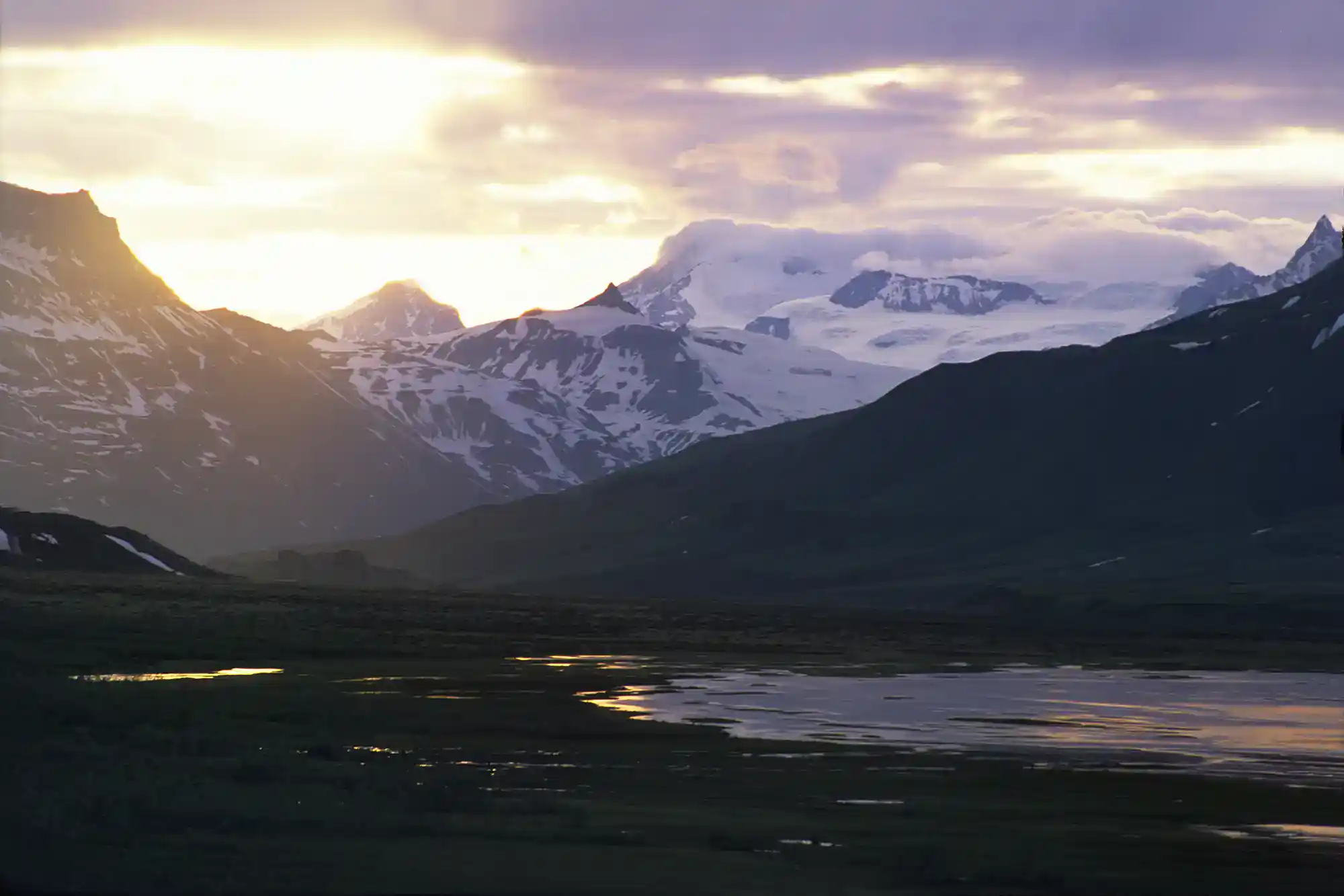 Guided Alaska trips backpacking Skolai Pass sunset, GoatTrail trip, Wrangell-St. Elias National Park, Alaska.