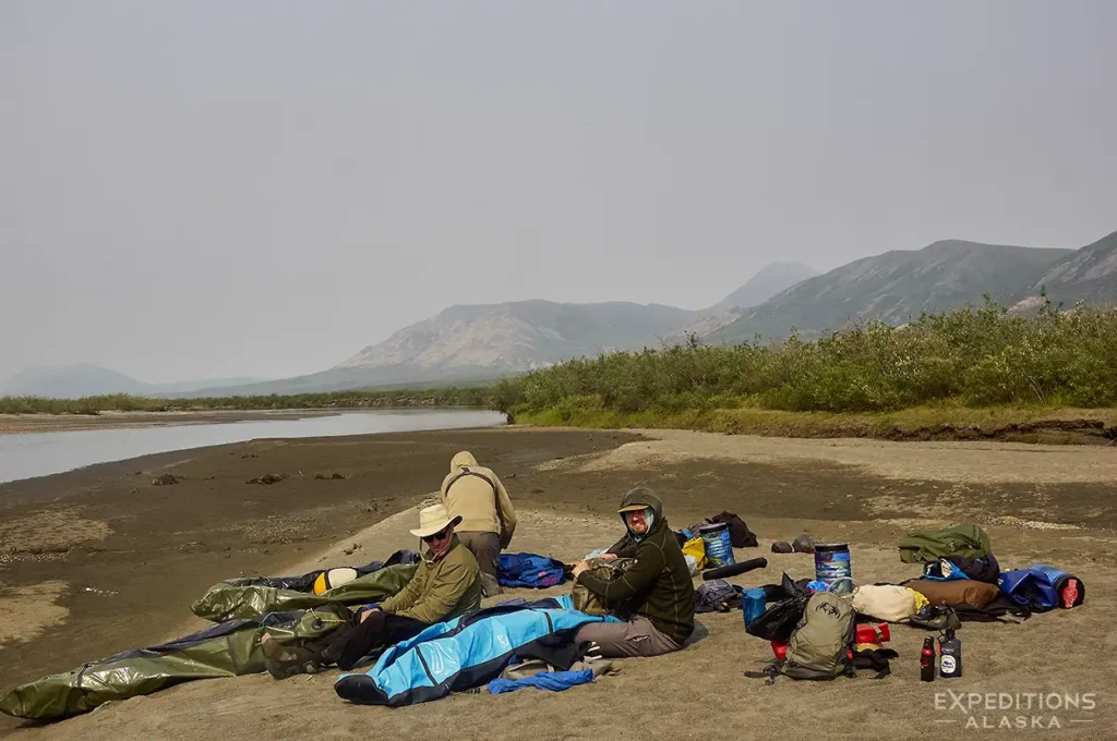 Breaking camp on Noatak River, Alaska.