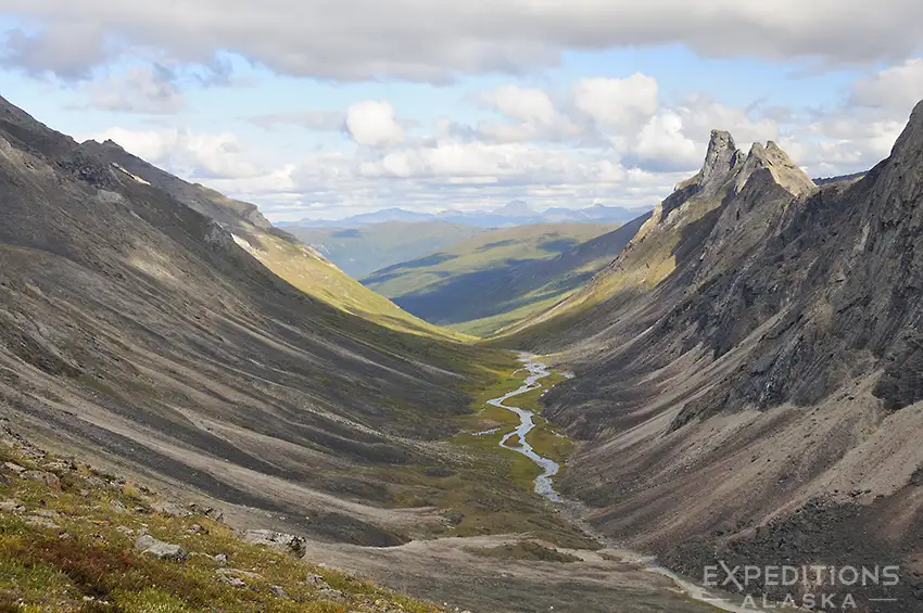 Backpacking in the Brooks Range, hikers explore the Arrigetch Peaks of Gates of the Arctic National Park, Alaska.