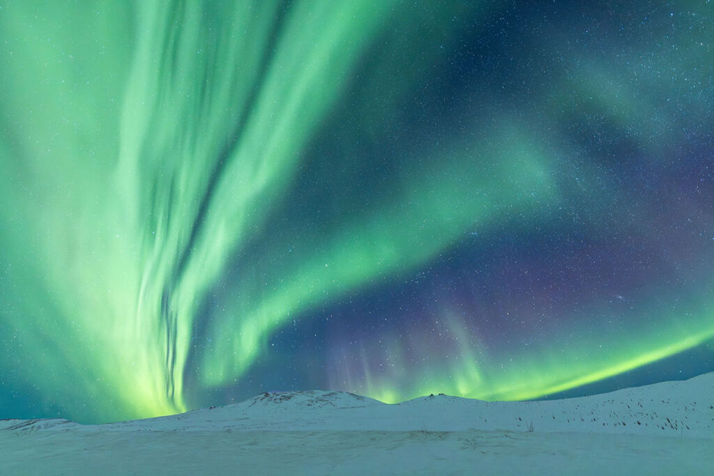 Spectacular aurora borealis photo from our March Aurora Borealis Photo Tour by guest Kim Merritt.